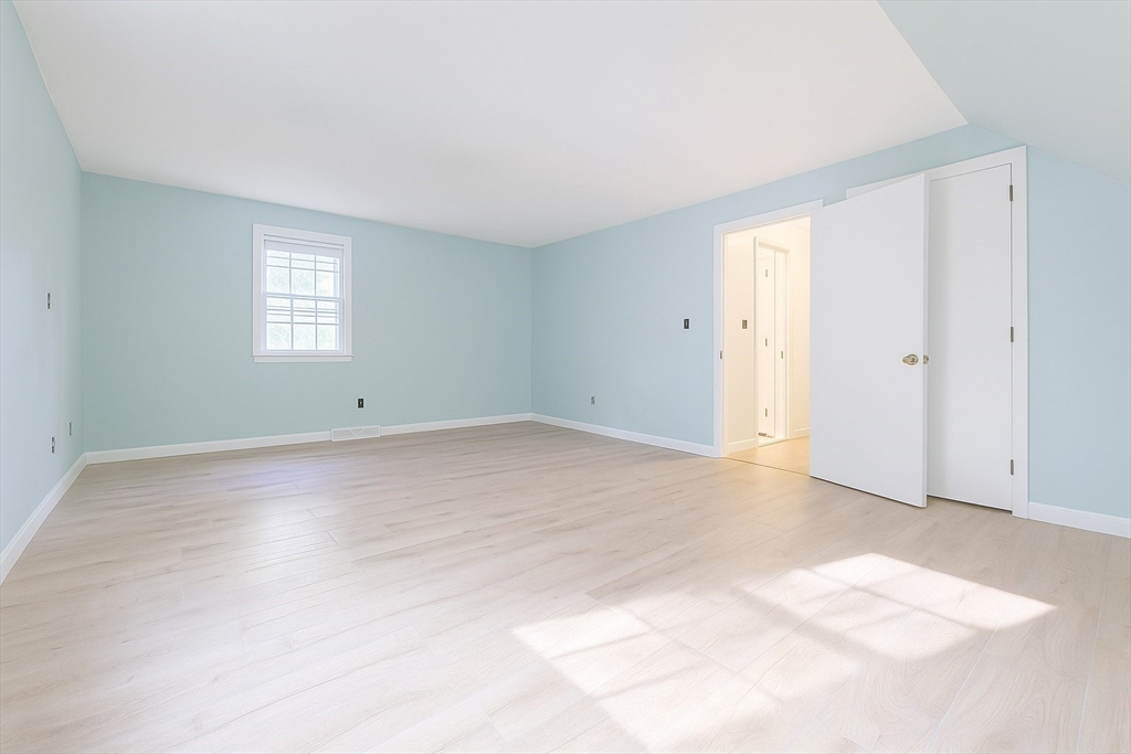49 St Marks Road Falmouth, MA 02536 - Photo 31 of 38 a view of an empty room with wooden floor and a window