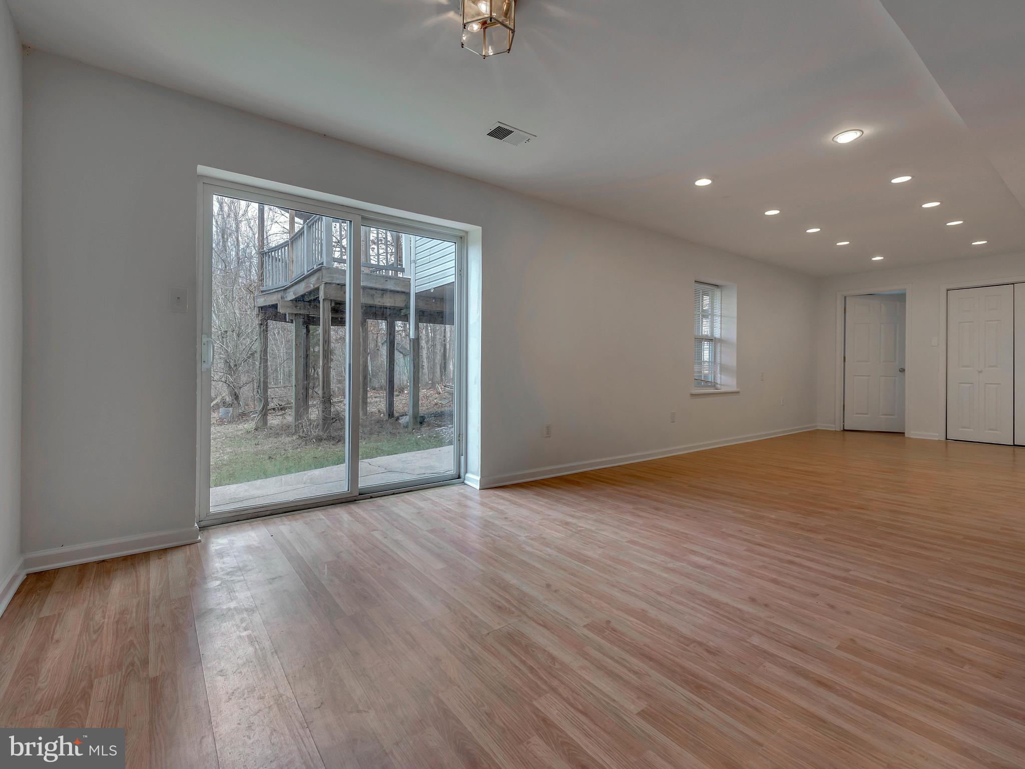 11004 Frederick Road Ellicott City, MD 21042 - Photo 23 of 30 Huge Rec room in walkout level LL