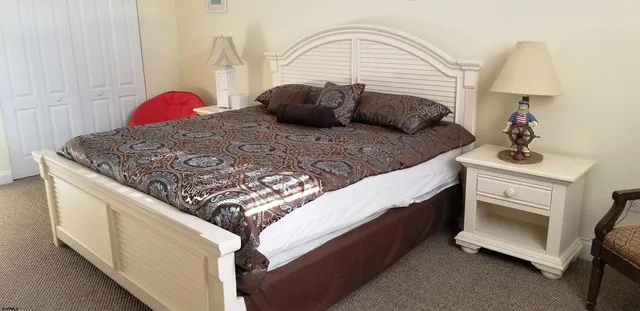 a bedroom with bed and a dresser