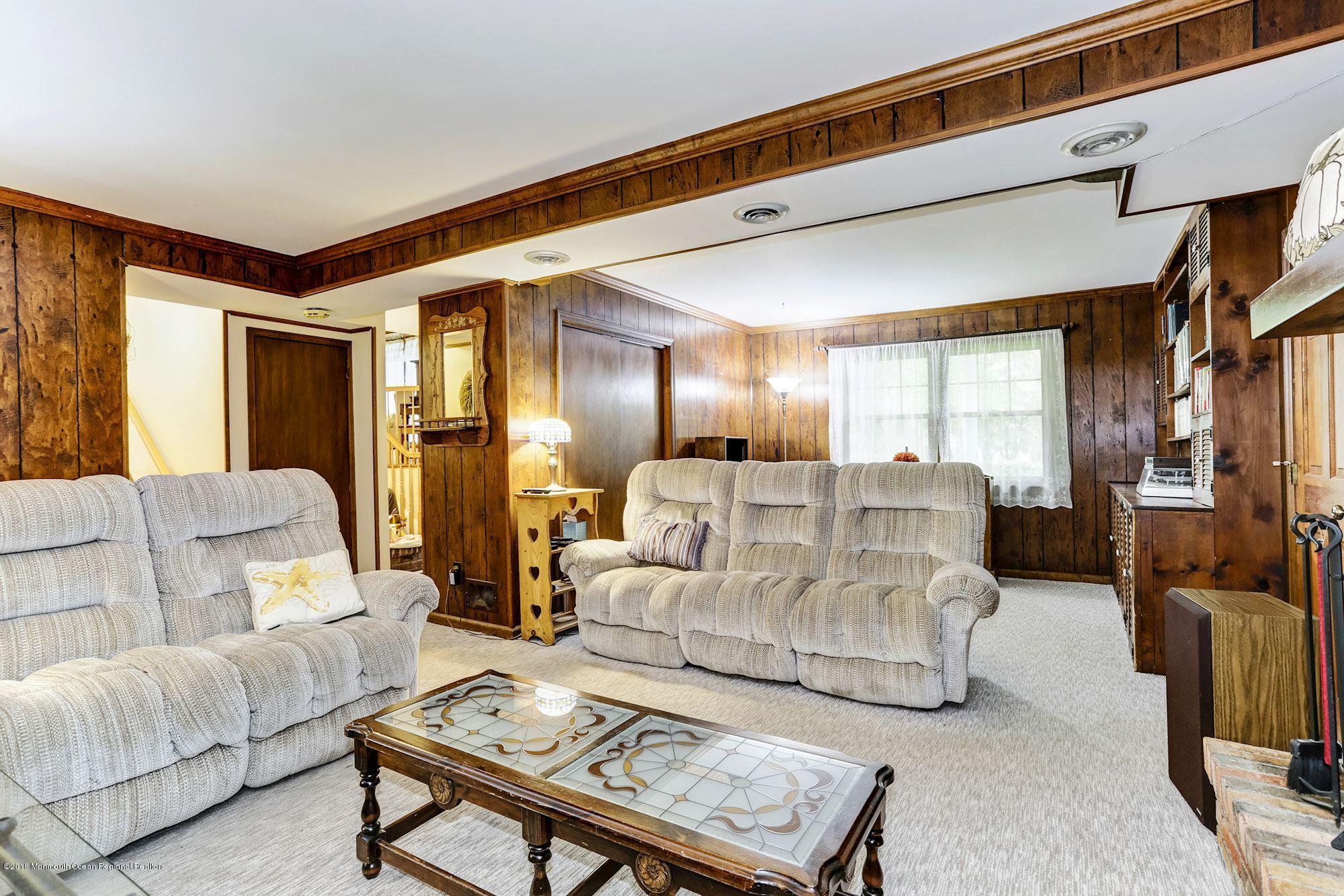 3 East Point Road Lincroft, NJ 07738 - Photo 21 of 42 a living room with furniture and a table