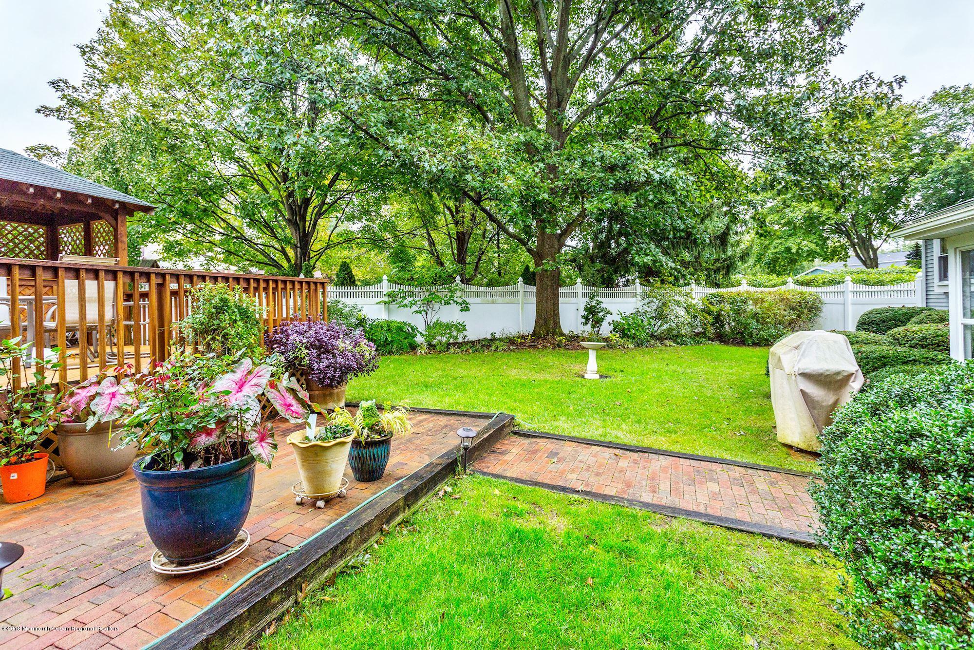 3 East Point Road Lincroft, NJ 07738 - Photo 34 of 42 a view of a garden with patio