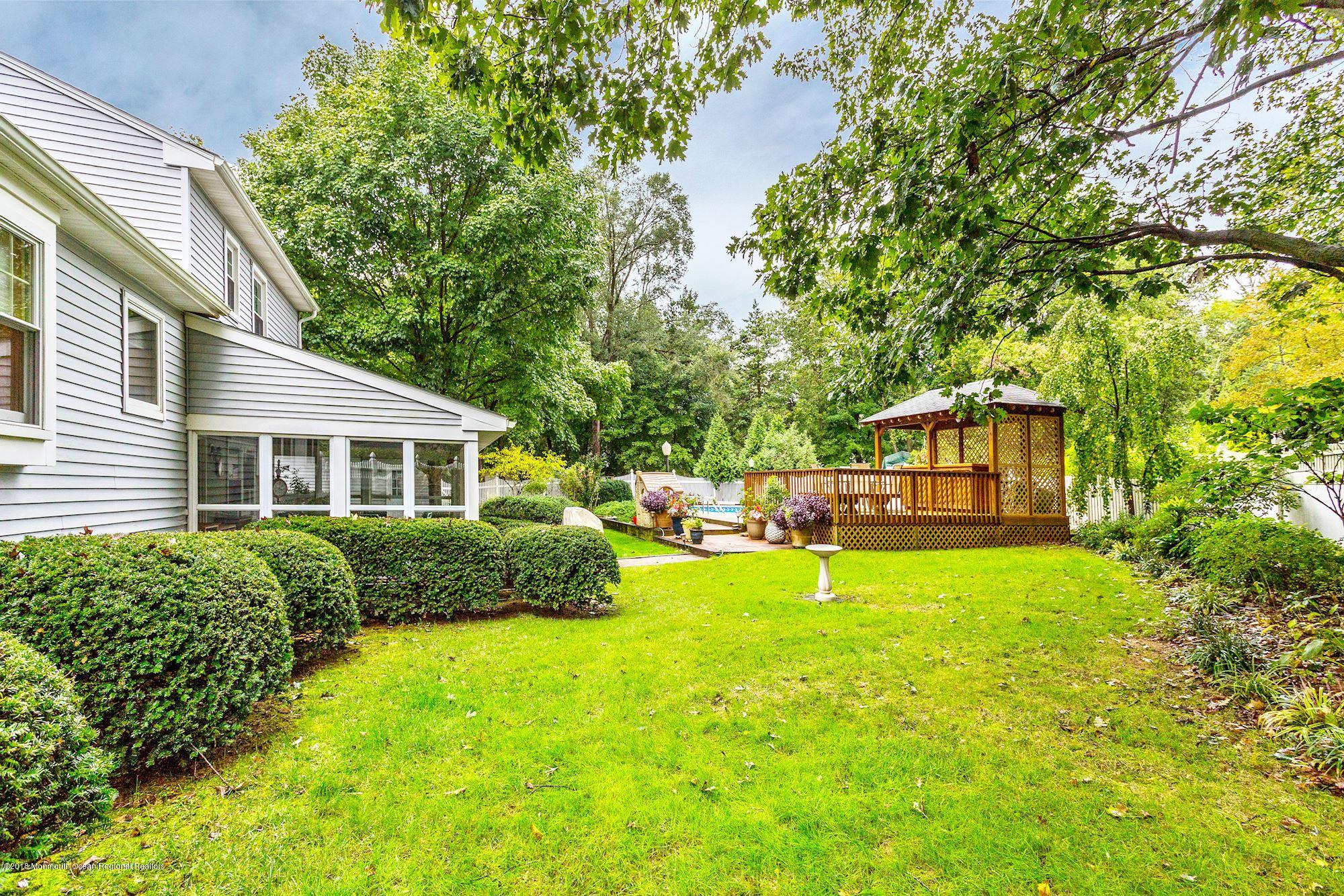 3 East Point Road Lincroft, NJ 07738 - Photo 35 of 42 a front view of a house with yard and green space