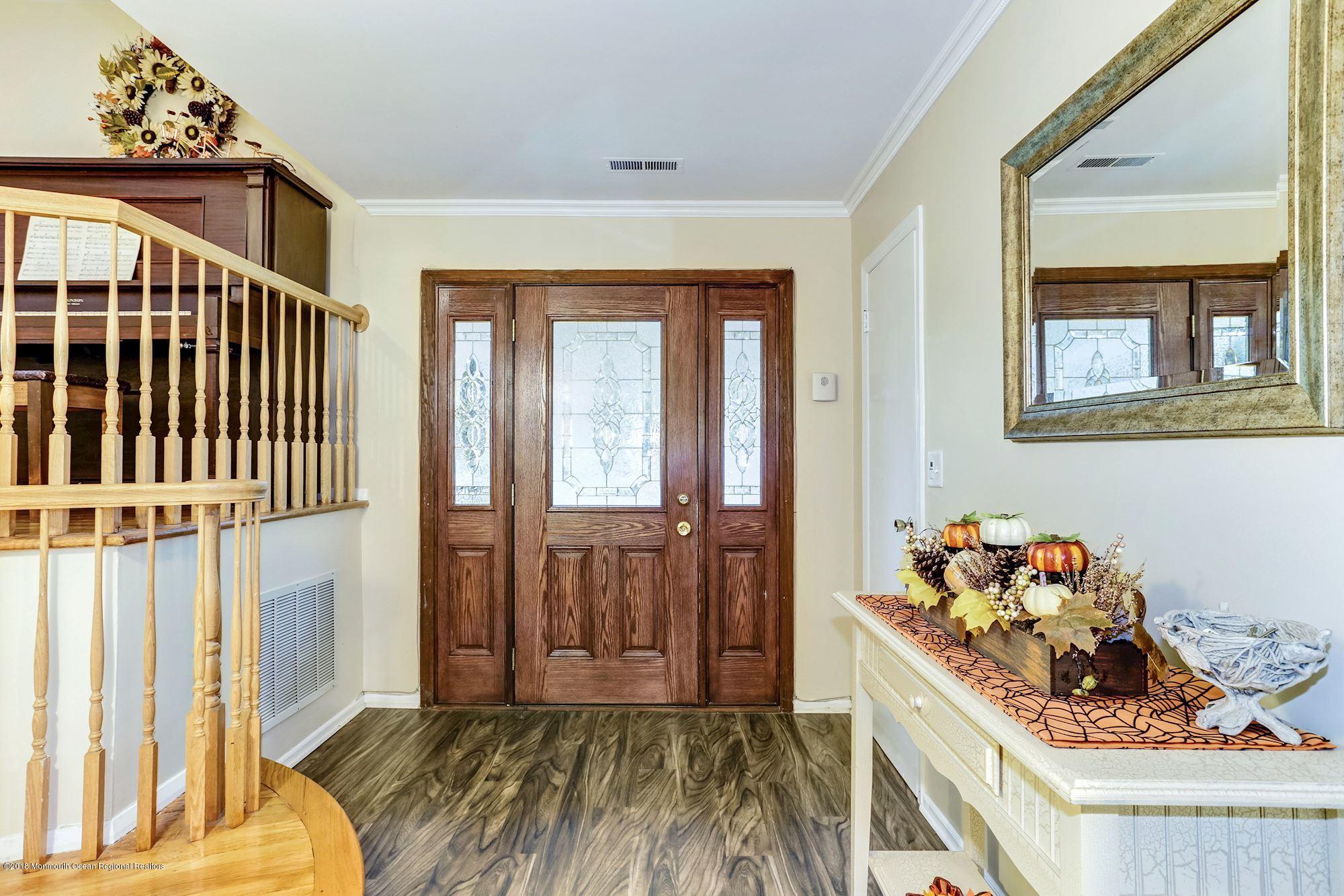 3 East Point Road Lincroft, NJ 07738 - Photo 5 of 42 a view of a livingroom with wooden floor and a floor to ceiling window