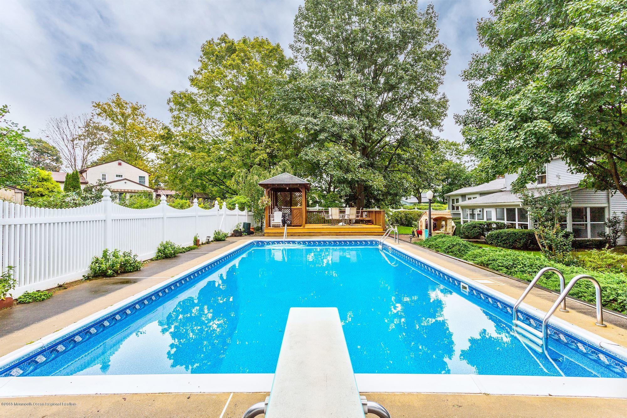 3 East Point Road Lincroft, NJ 07738 - Photo 42 of 42 a view of a swimming pool with a patio