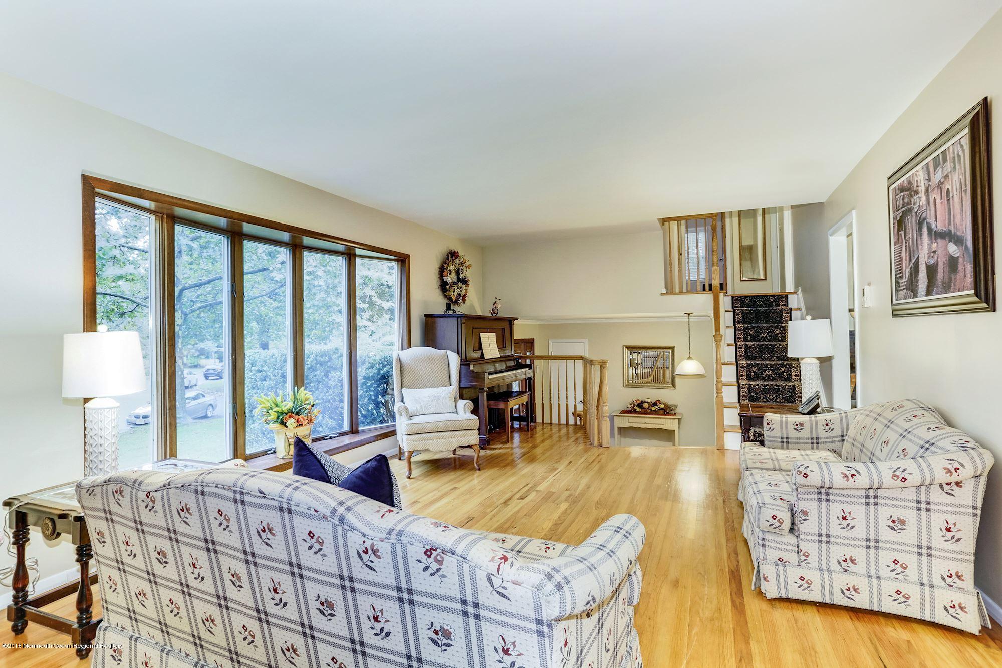 3 East Point Road Lincroft, NJ 07738 - Photo 7 of 42 a living room with furniture and large windows