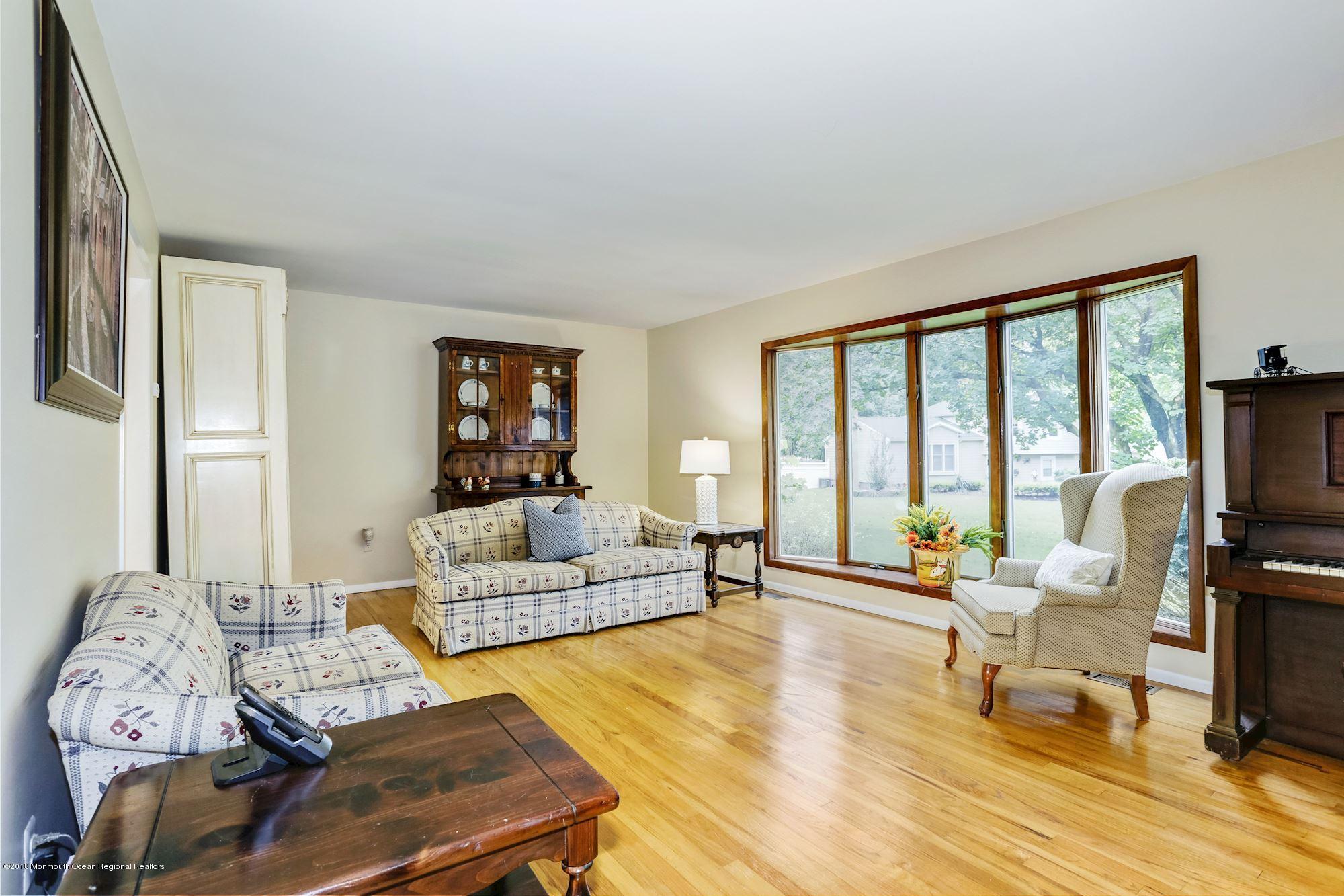 3 East Point Road Lincroft, NJ 07738 - Photo 10 of 42 a living room with furniture and a flat screen tv