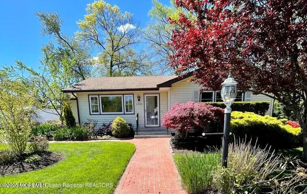 a front view of house with yard and outdoor seating