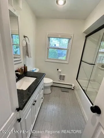 a bathroom with a sink a mirror and a shower