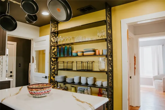 a kitchen with a table and a stove