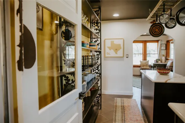 a view of a entryway door with hallway