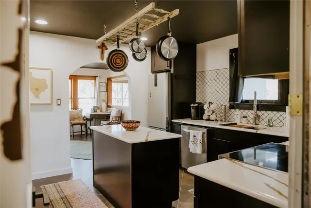 a kitchen with a sink and cabinets