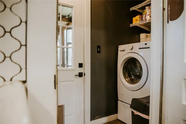 a view of a hallway with washer and dryer