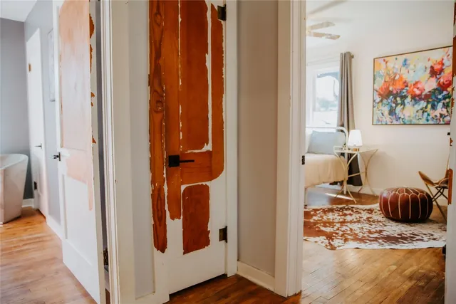 a view of hallway with wooden floor