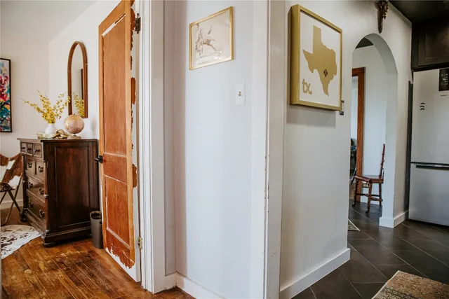 a view of hallway with wooden floor