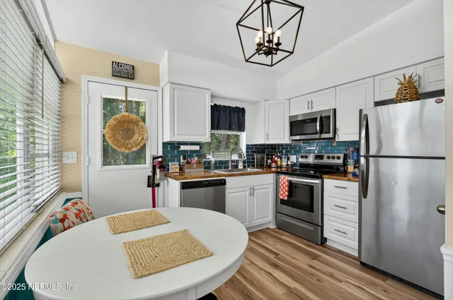 a bathroom with a sink a mirror and shower