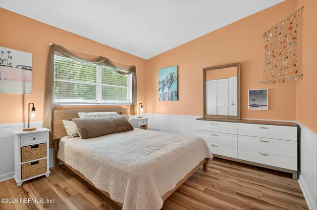 an aerial view of a residential houses with outdoor space and street view