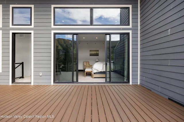 a bedroom with a large bed and a large window