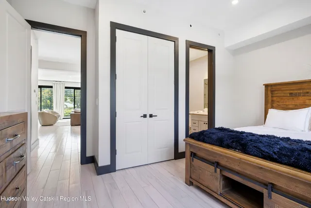 a bedroom with a bed and a chair