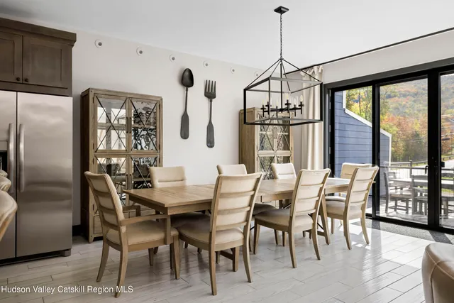 a view of a dining room with furniture window and outside view