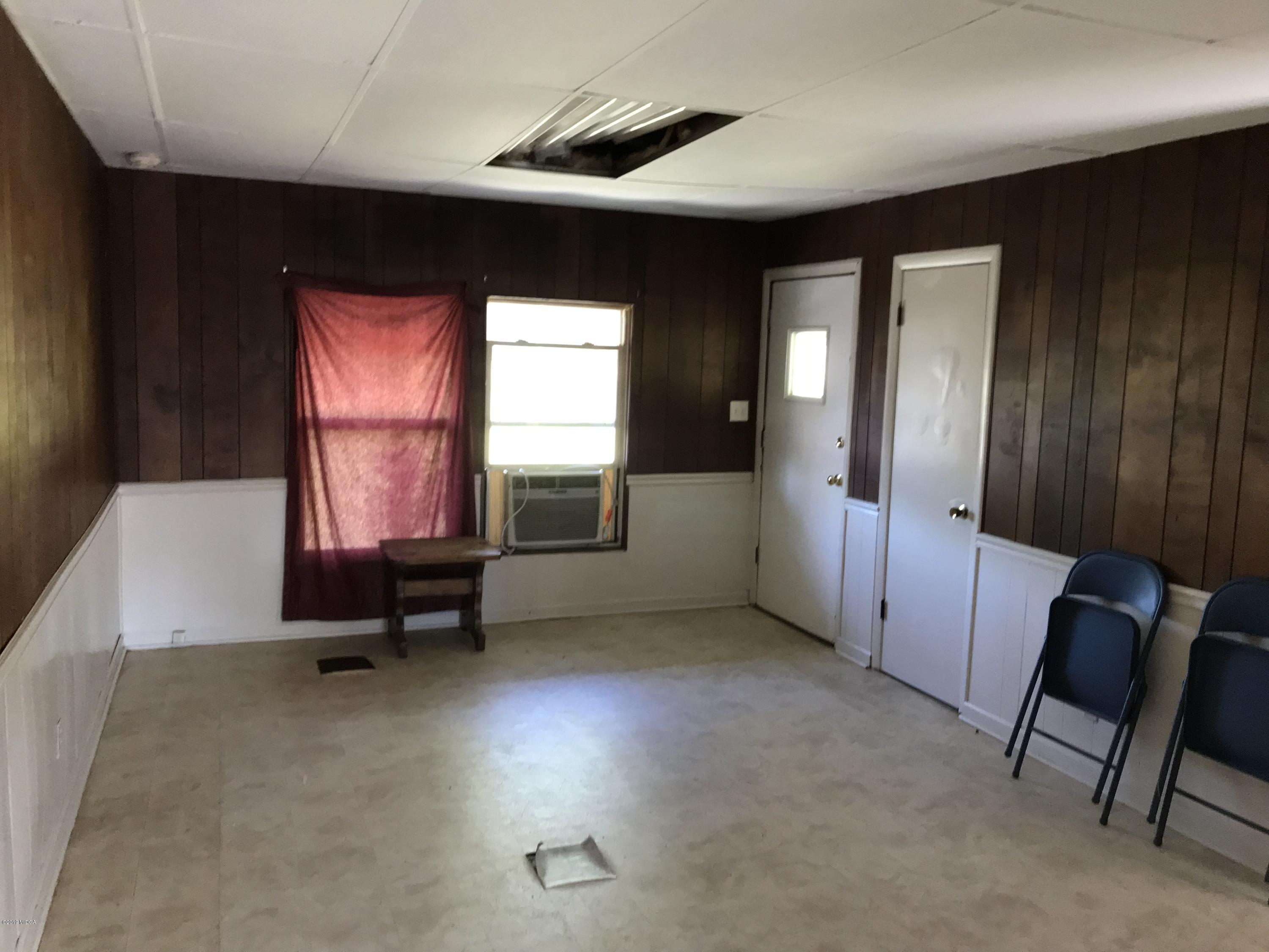 224 Chambers Road Macon, GA 31217 - Photo 2 of 16 an empty room with windows and closet