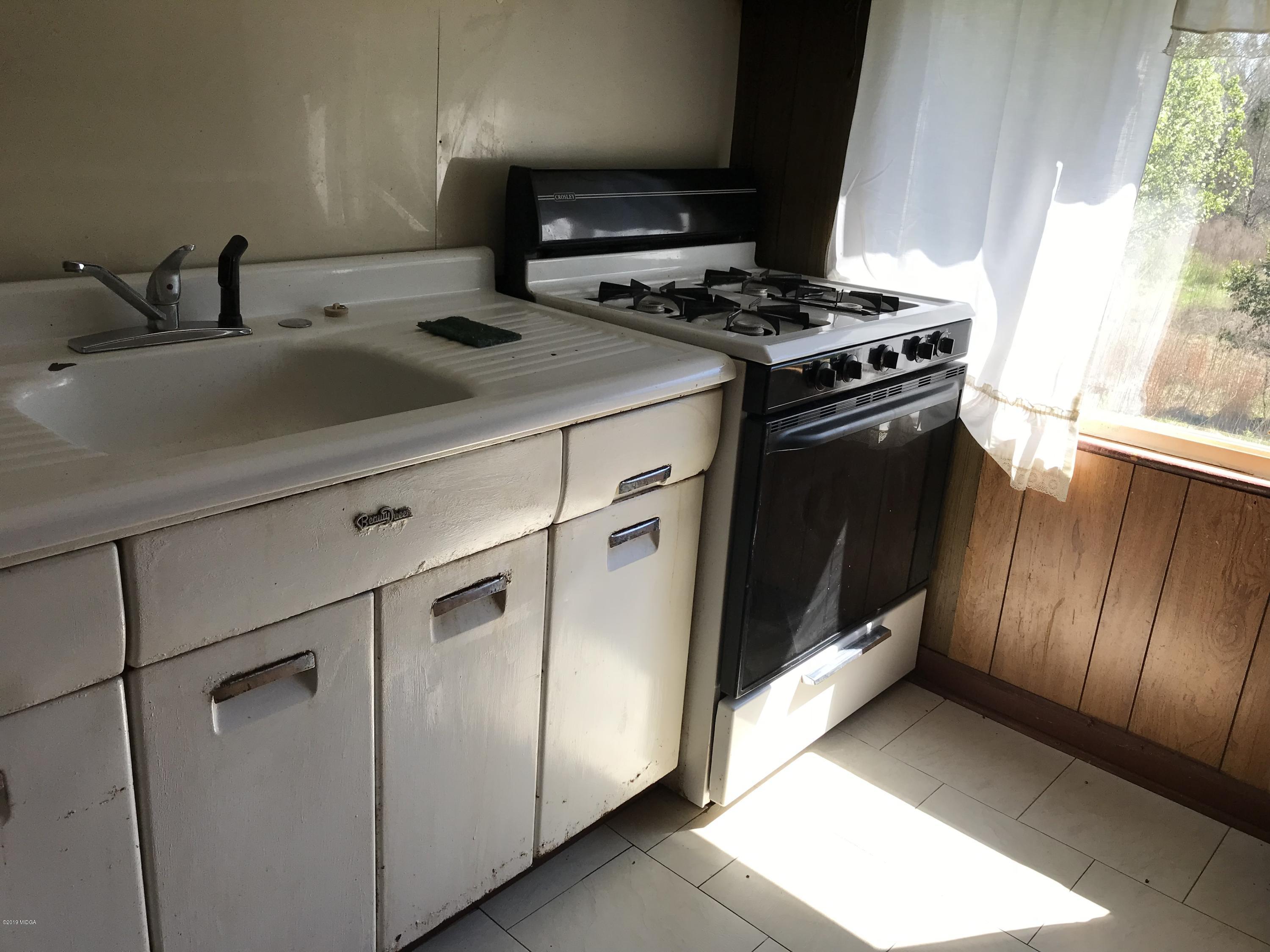 224 Chambers Road Macon, GA 31217 - Photo 4 of 16 a kitchen with a stove and a sink