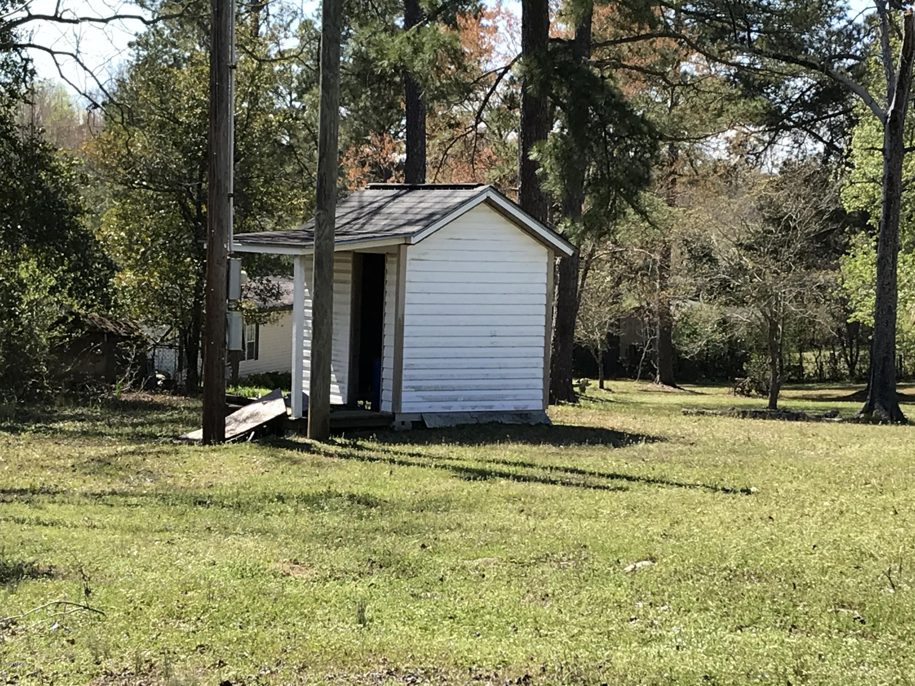 224 Chambers Road Macon, GA 31217 - Photo 10 of 16 a view of a backyard with a small cabin