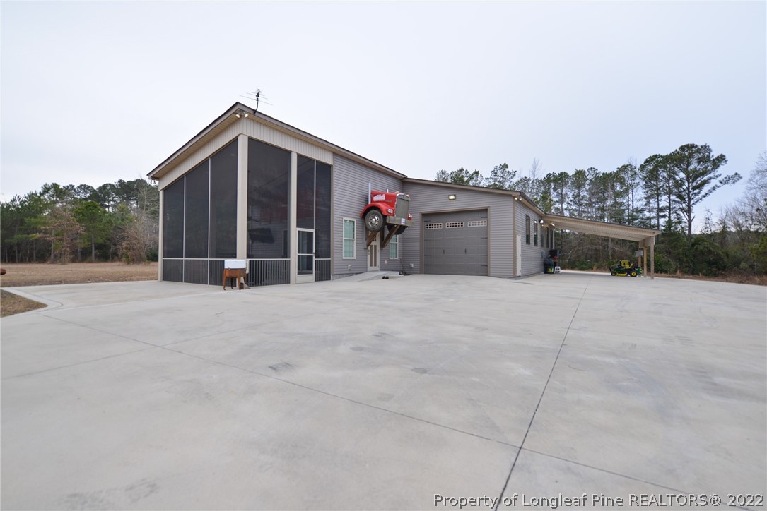 5671 Stewart Road Godwin, NC 28344 - Photo 1 of 45 a view of the house with a yard