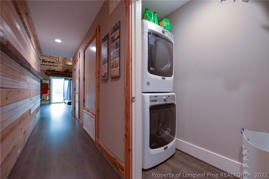 5671 Stewart Road Godwin, NC 28344 - Photo 13 of 45 a view of a hallway with washer and dryer