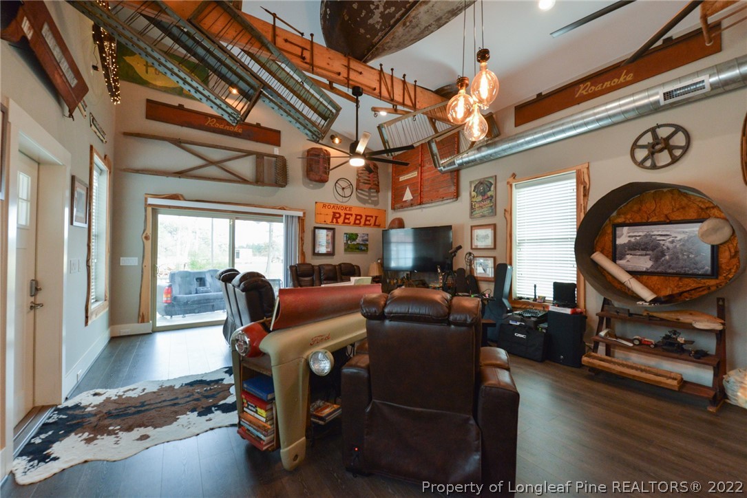 5671 Stewart Road Godwin, NC 28344 - Photo 2 of 45 a living room with furniture a flat screen tv and a window