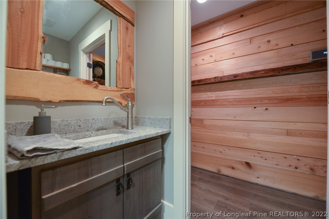 5671 Stewart Road Godwin, NC 28344 - Photo 23 of 45 a bathroom with a sink and a mirror