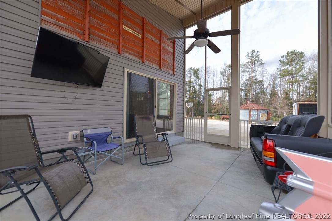 5671 Stewart Road Godwin, NC 28344 - Photo 31 of 45 a building outdoor space with patio furniture