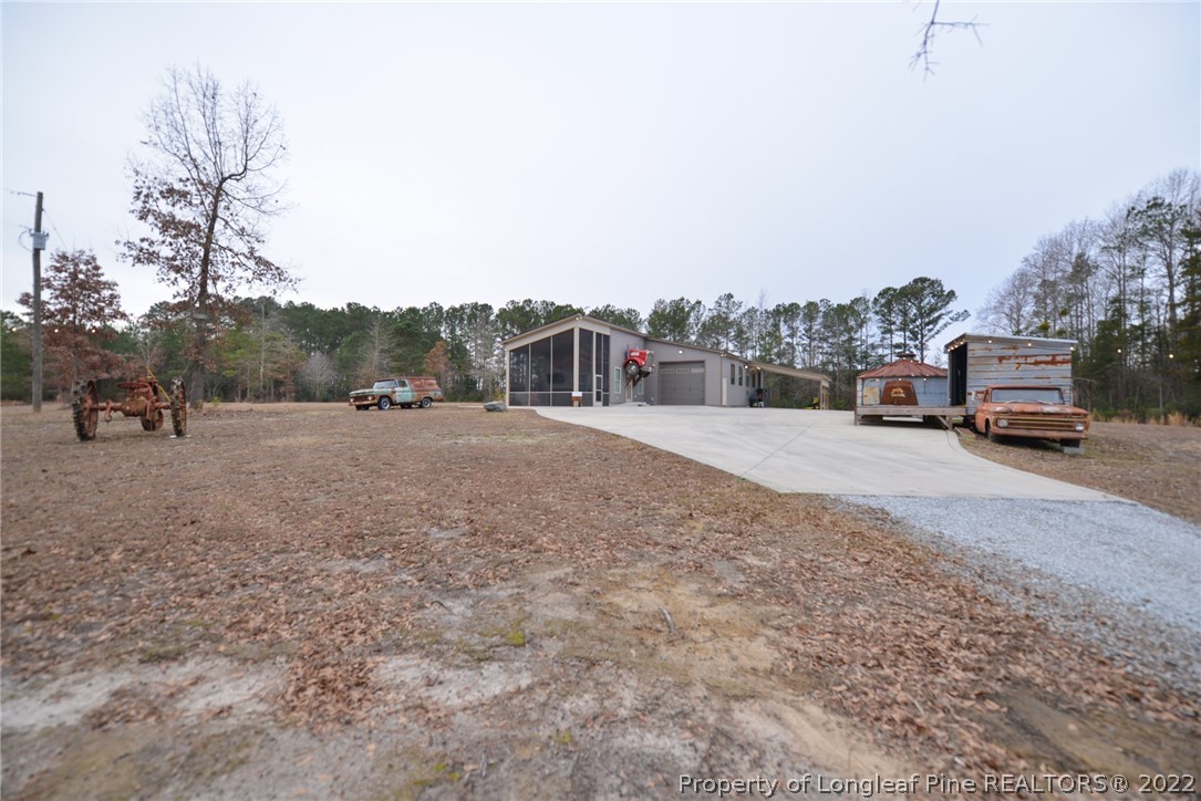5671 Stewart Road Godwin, NC 28344 - Photo 33 of 45 a car parked on the side of the road