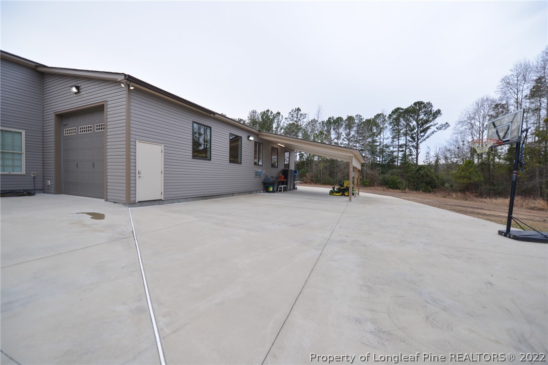 5671 Stewart Road Godwin, NC 28344 - Photo 37 of 45 a view of a house with a snow on the road