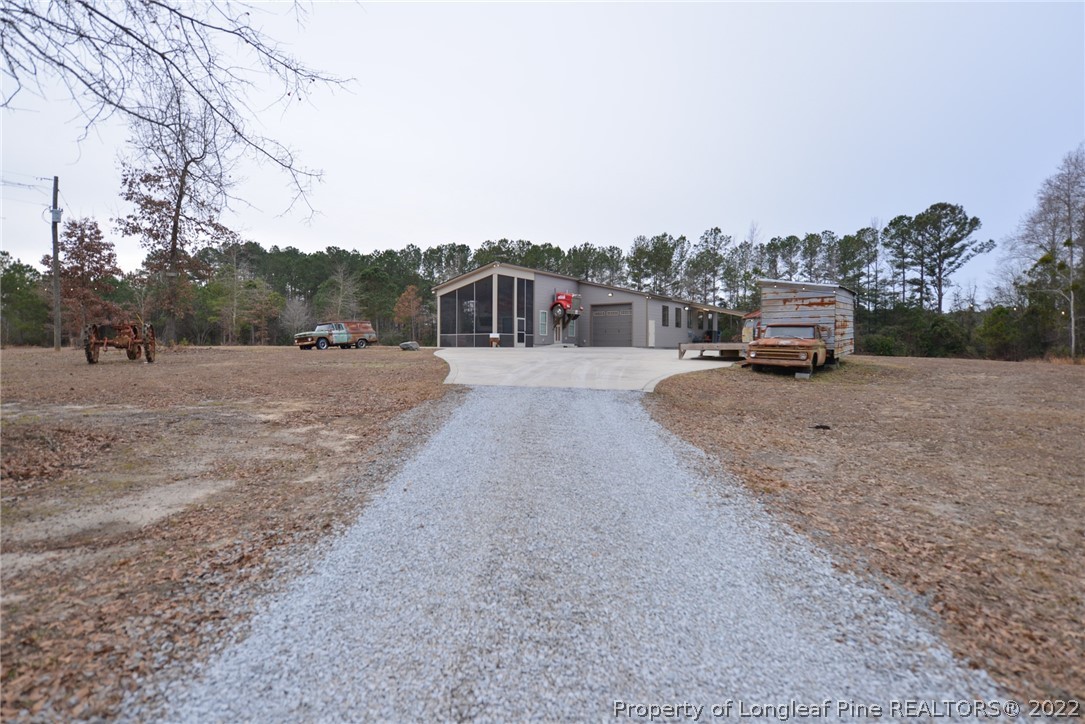 5671 Stewart Road Godwin, NC 28344 - Photo 40 of 45 a car parked on the side of the road