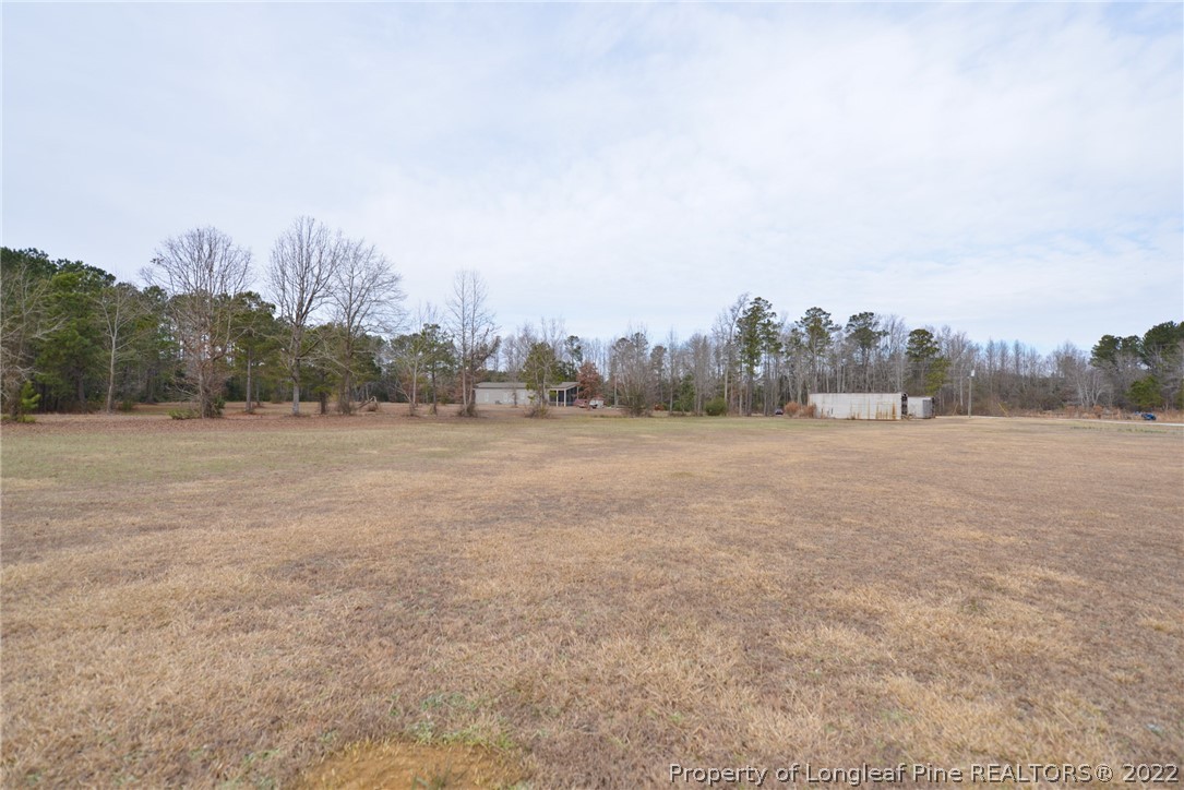5671 Stewart Road Godwin, NC 28344 - Photo 41 of 45 a view of a field with trees in background