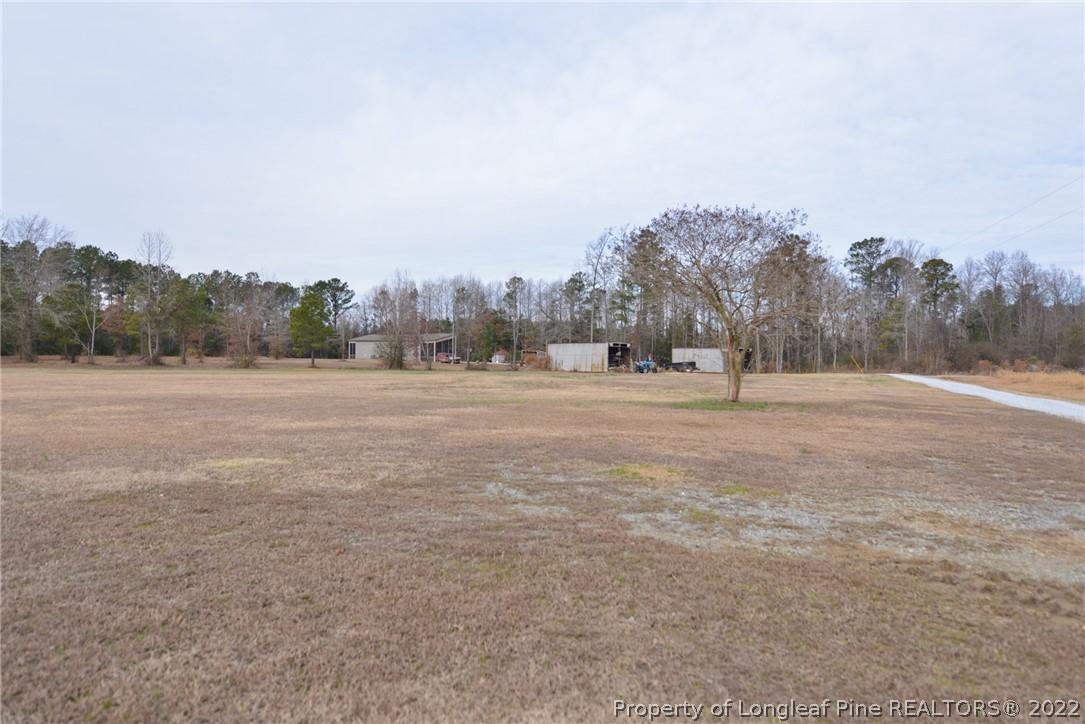 5671 Stewart Road Godwin, NC 28344 - Photo 42 of 45 a view of dirt field with trees in background