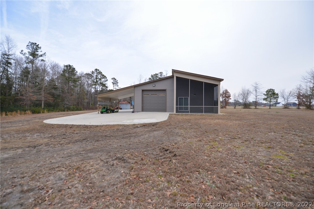 5671 Stewart Road Godwin, NC 28344 - Photo 44 of 45 a house view with a backyard space