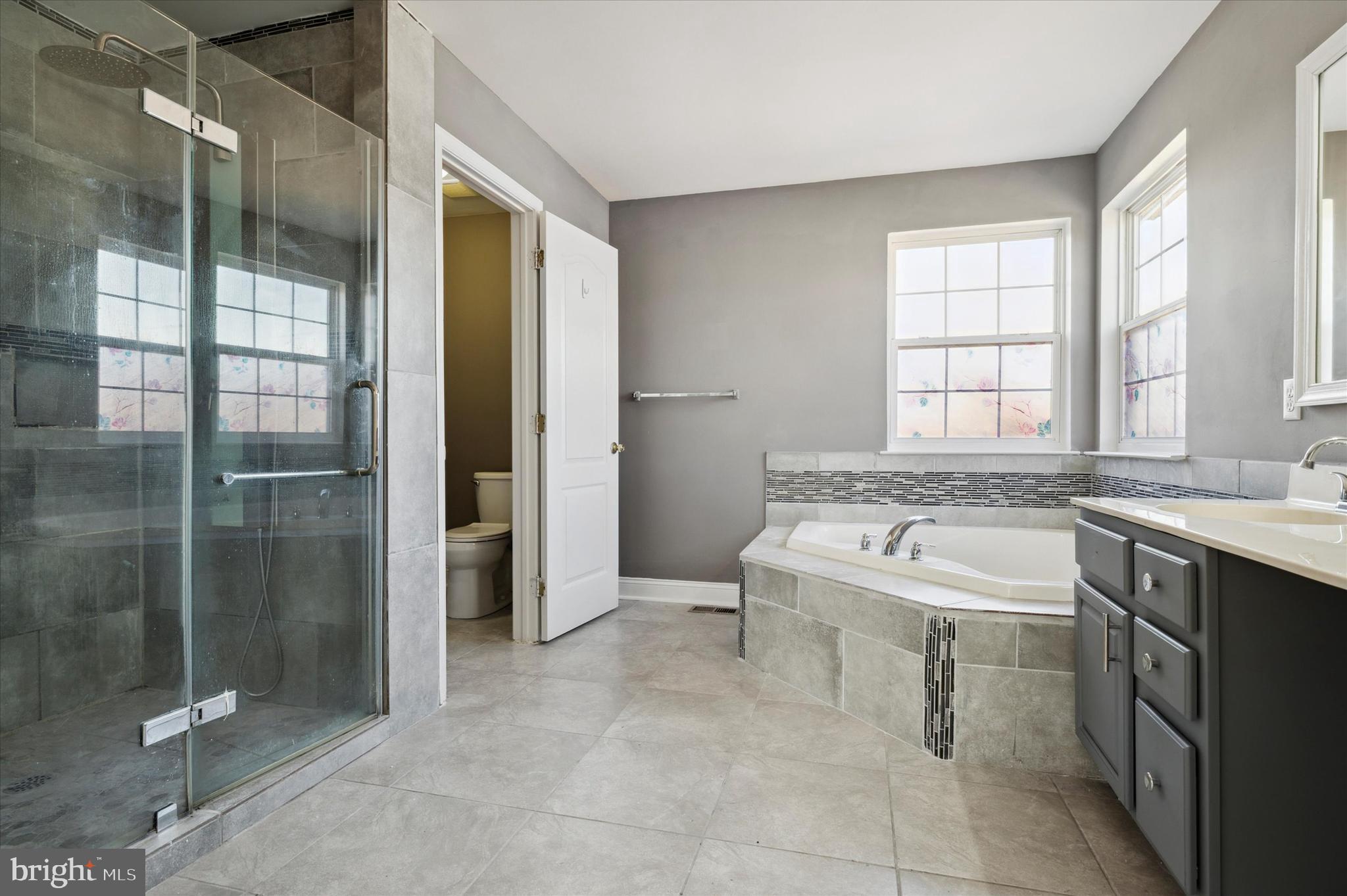 304 Friedman Drive New Castle, DE 19720 - Photo 24 of 40 Soaking Tub with Fully Tiled Stand up Shower