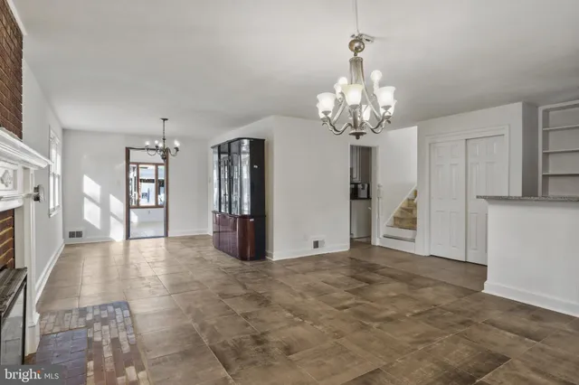 a view of a hallway with a chandelier
