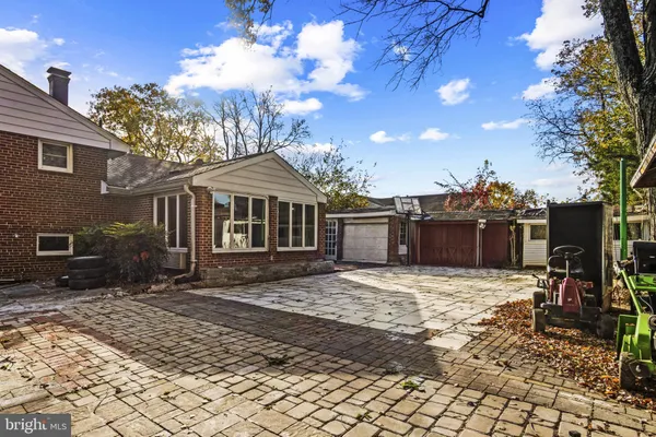 a view of a building with a bench in a patio