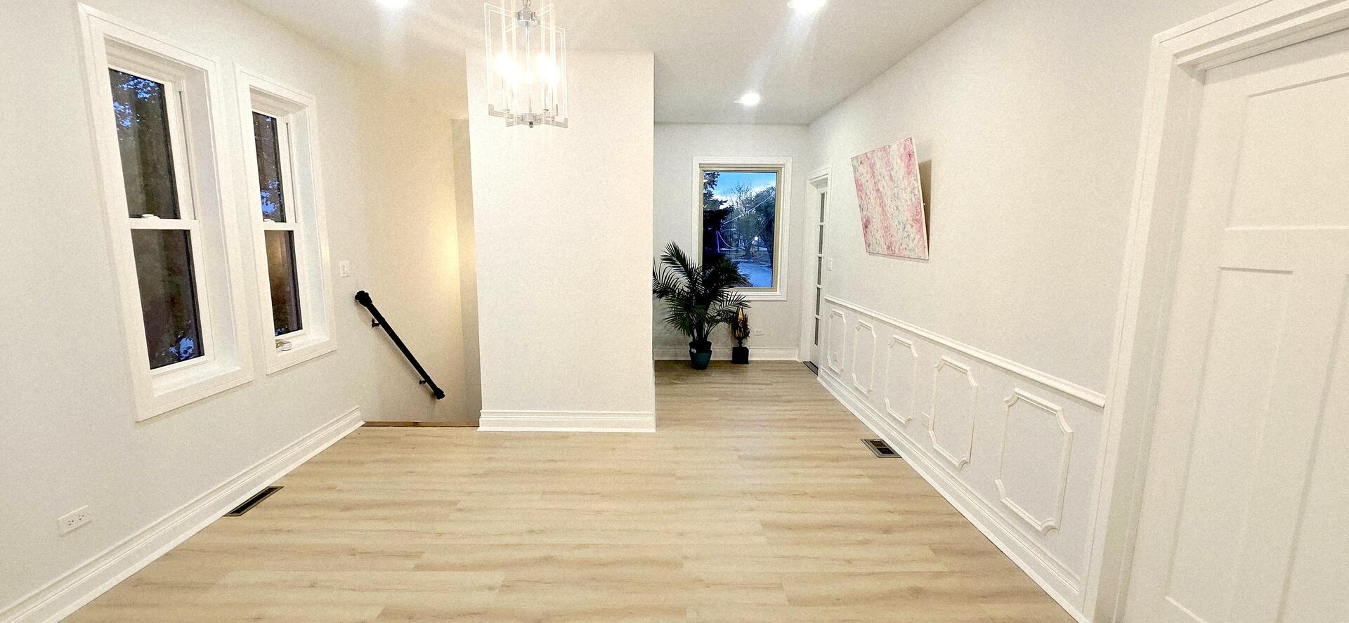 5936 West Maple Avenue Berkeley, IL 60163 - Photo 13 of 25 a view of a hallway with wooden floor and staircase