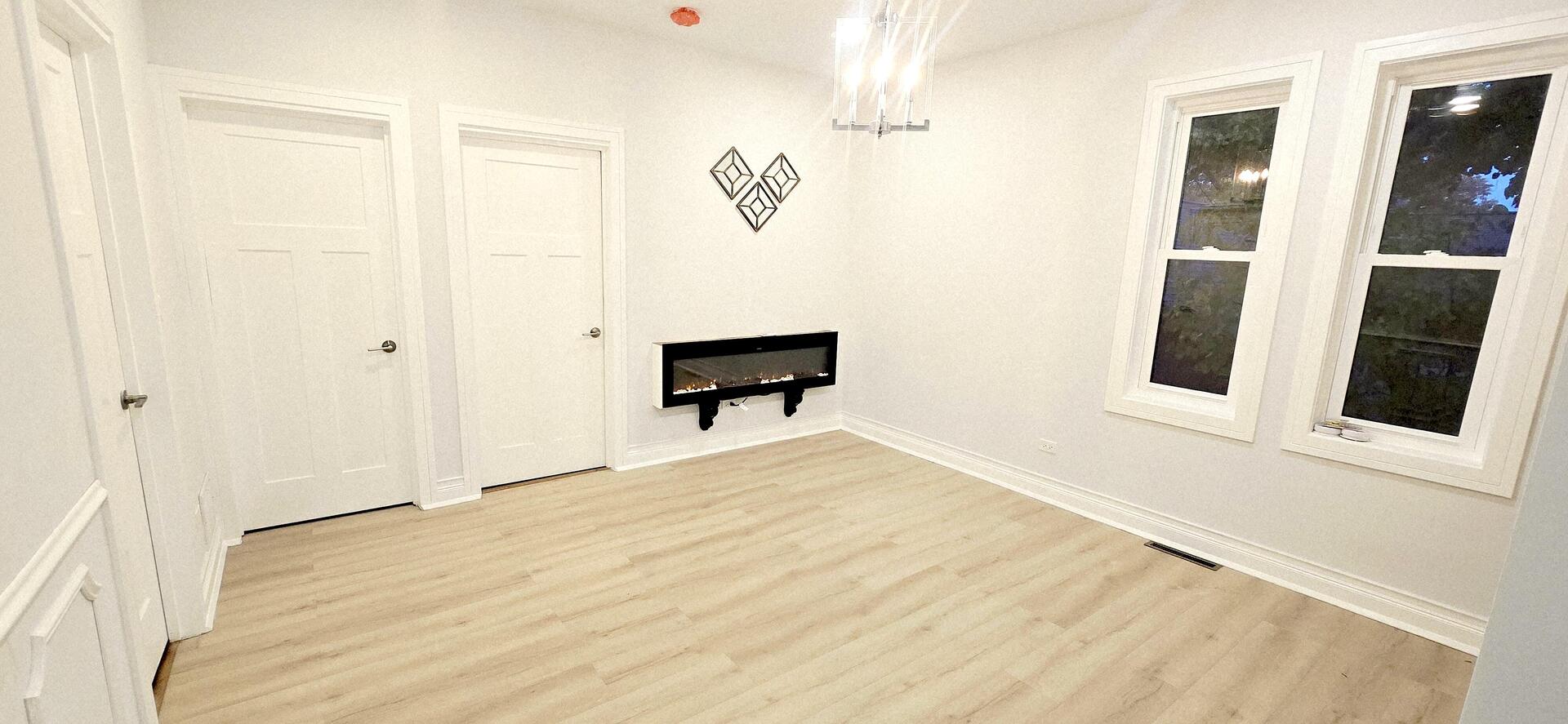 5936 West Maple Avenue Berkeley, IL 60163 - Photo 14 of 25 a view of an empty room with wooden floor and a window