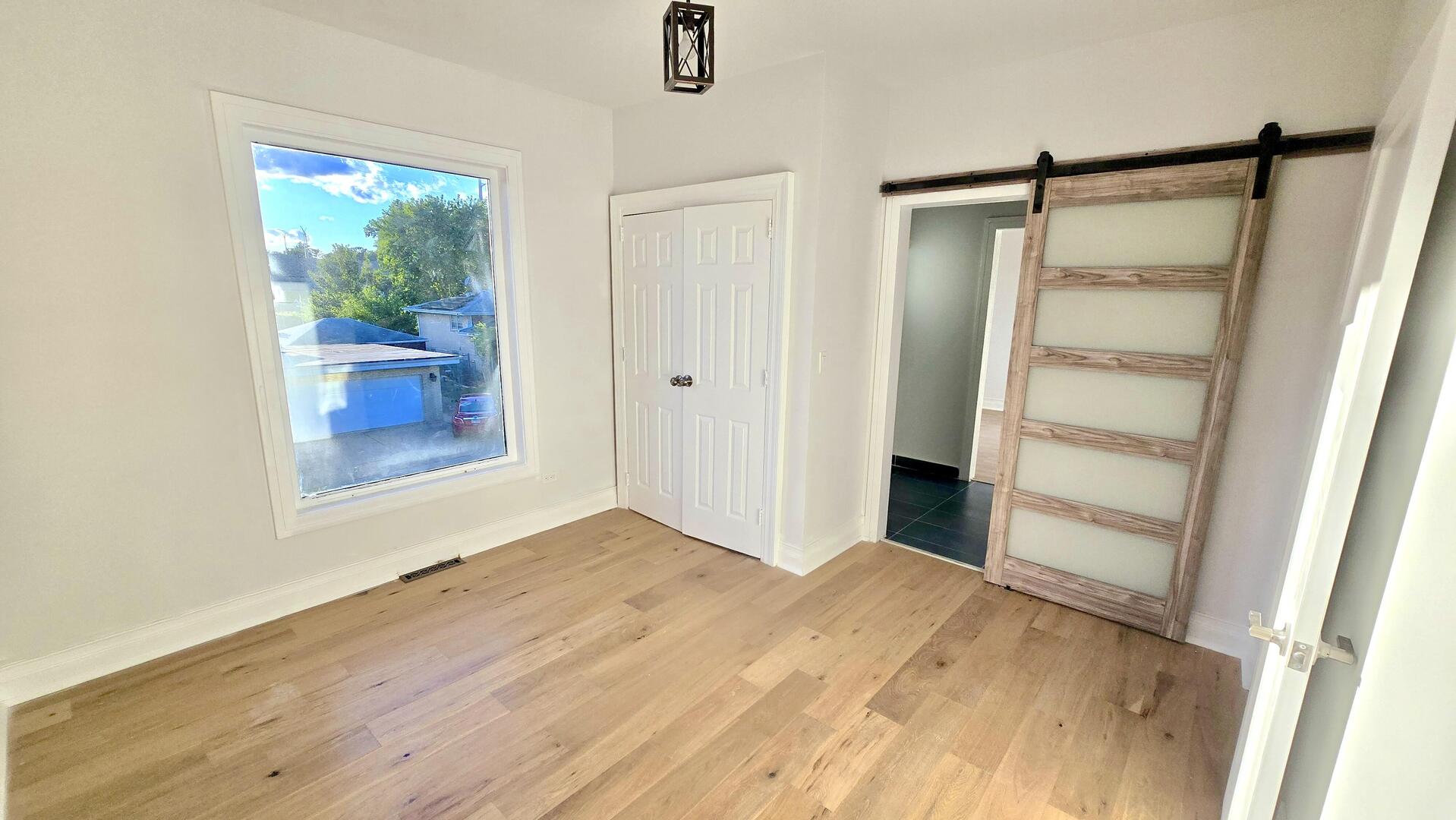 5936 West Maple Avenue Berkeley, IL 60163 - Photo 18 of 25 a view of an empty room with a window