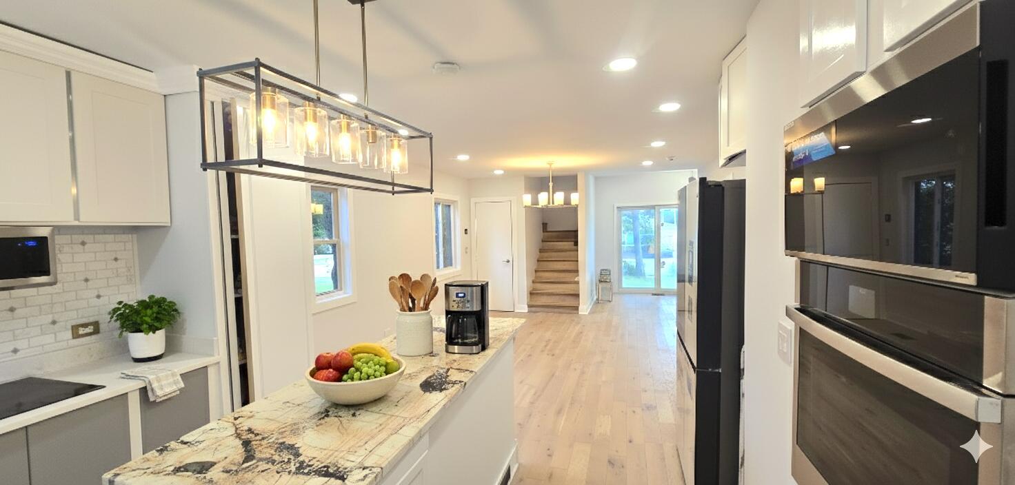 5936 West Maple Avenue Berkeley, IL 60163 - Photo 6 of 25 a bathroom with a sink mirror and shower