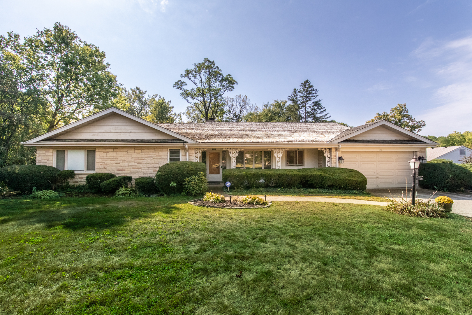 1137 Inverlieth Road Lake Forest, IL 60045 - Photo 1 of 1 a front view of a house with a yard