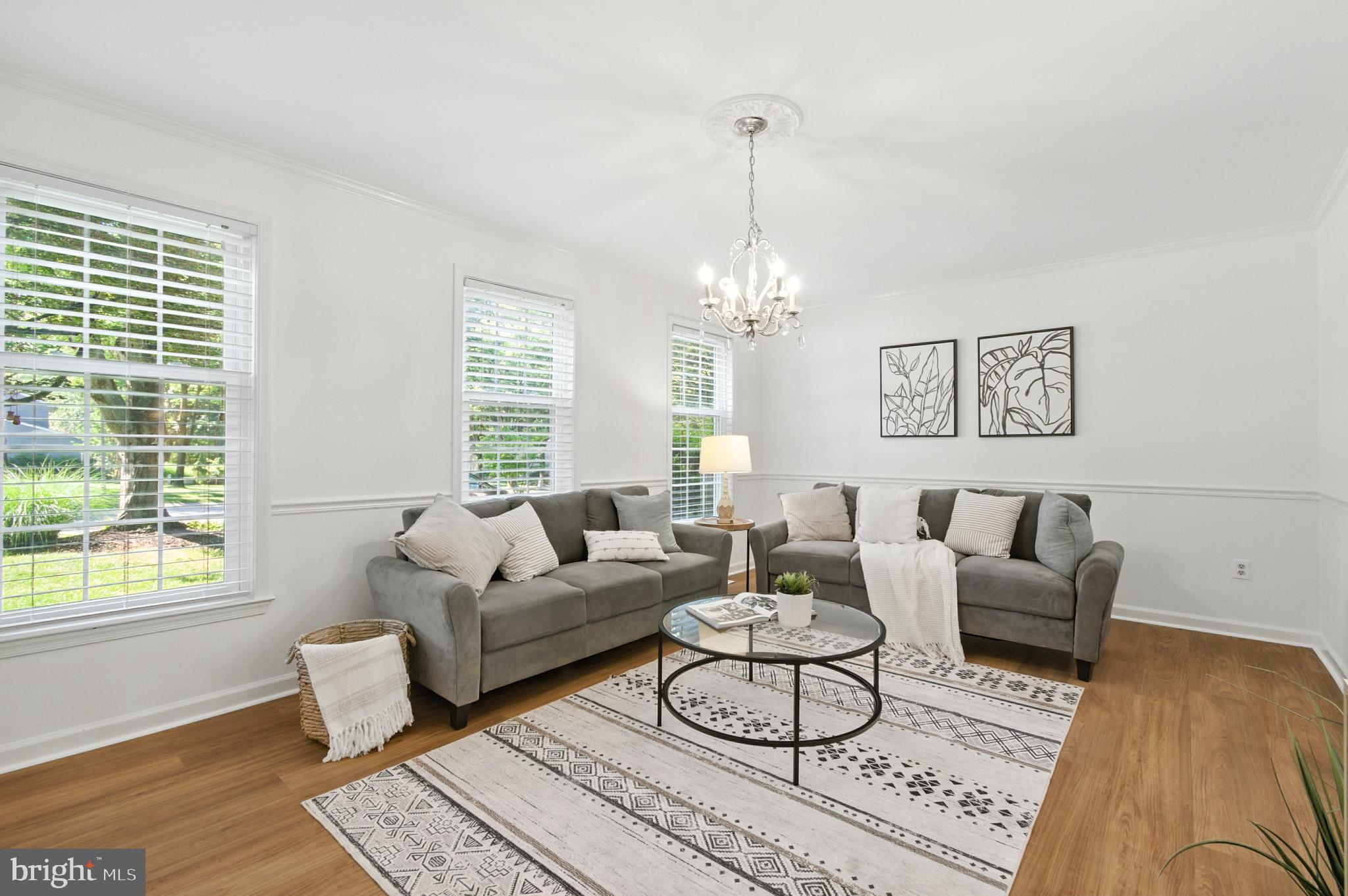 6030 Watch Chain Way Columbia, MD 21044 - Photo 16 of 90 a living room with furniture and a chandelier