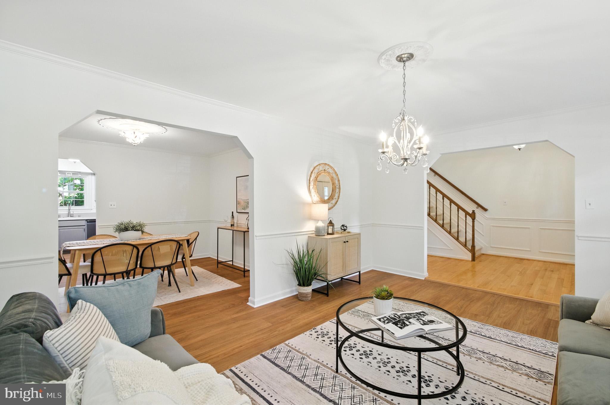 6030 Watch Chain Way Columbia, MD 21044 - Photo 18 of 90 a living room with furniture a dining table and a chandelier