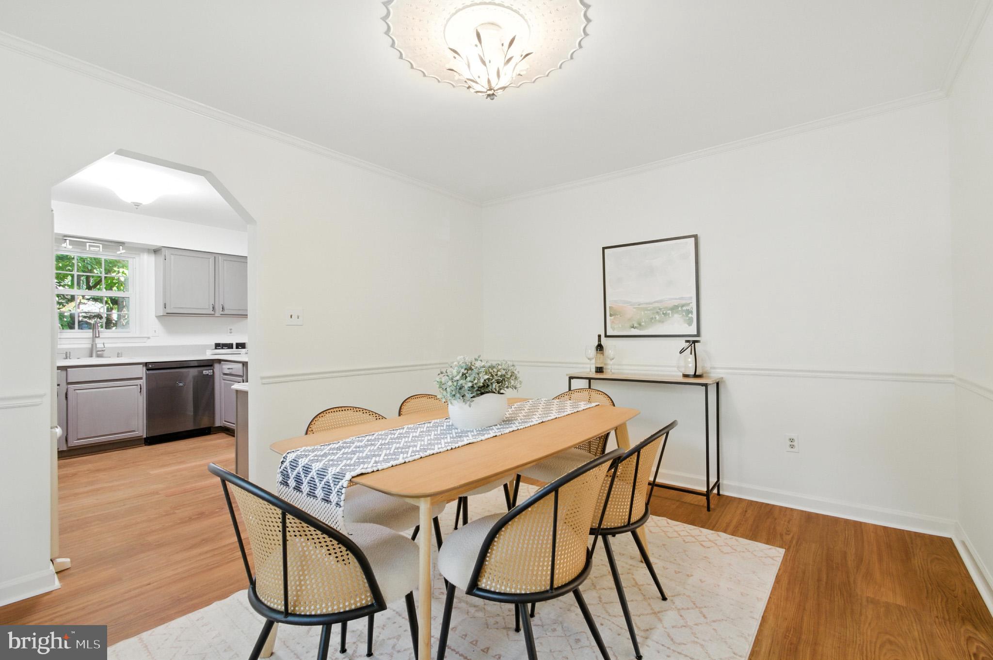 6030 Watch Chain Way Columbia, MD 21044 - Photo 20 of 90 a view of a dining room with furniture and a chandelier