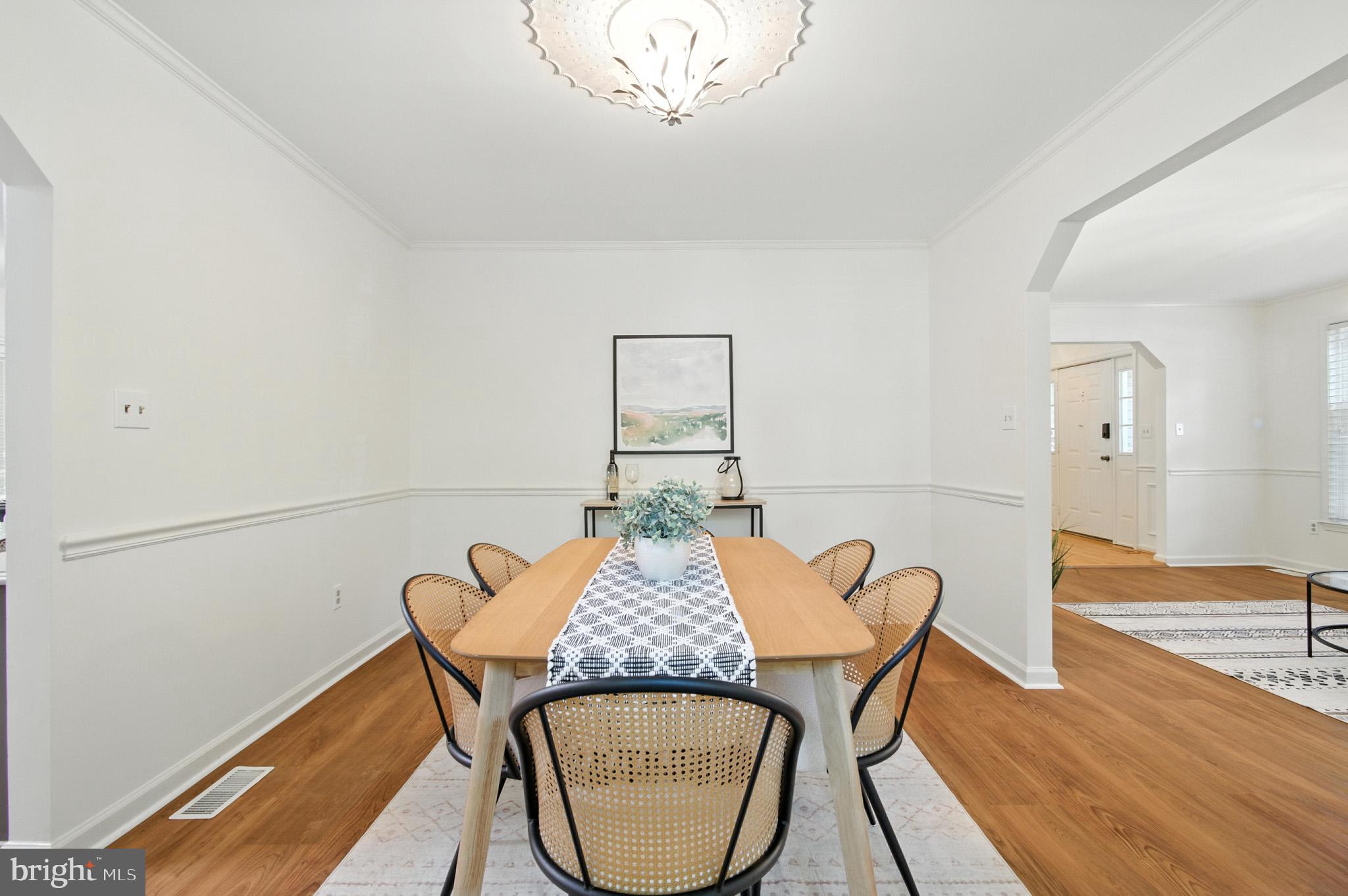 6030 Watch Chain Way Columbia, MD 21044 - Photo 21 of 90 a view of a dining room with furniture and wooden floor