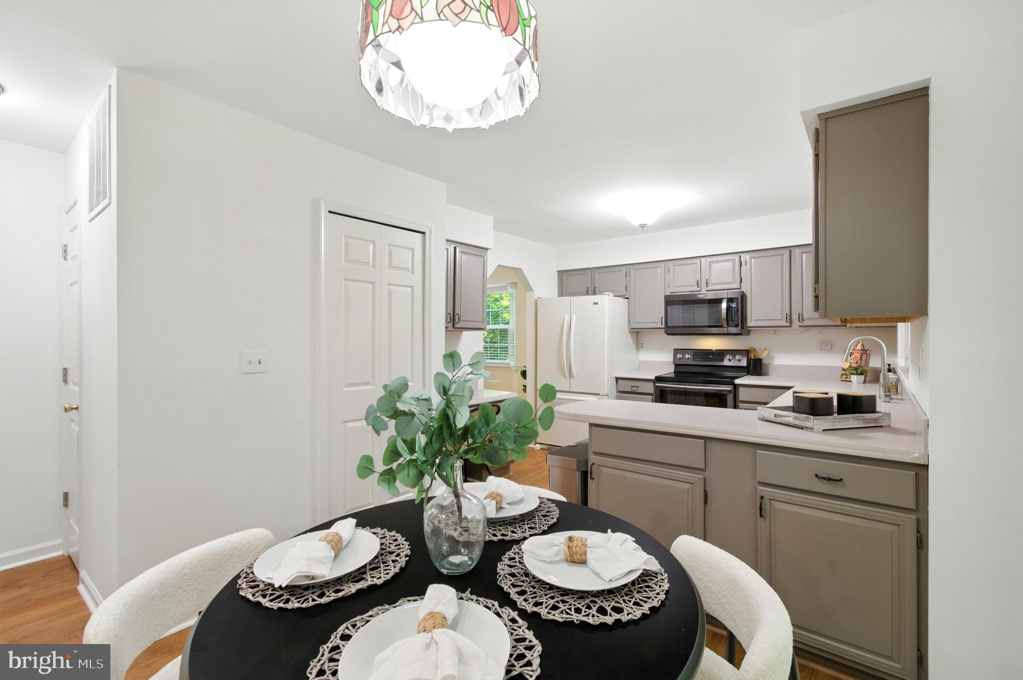 6030 Watch Chain Way Columbia, MD 21044 - Photo 29 of 90 a kitchen with a table and chairs in it